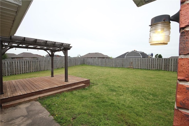 view of yard with a deck and a pergola
