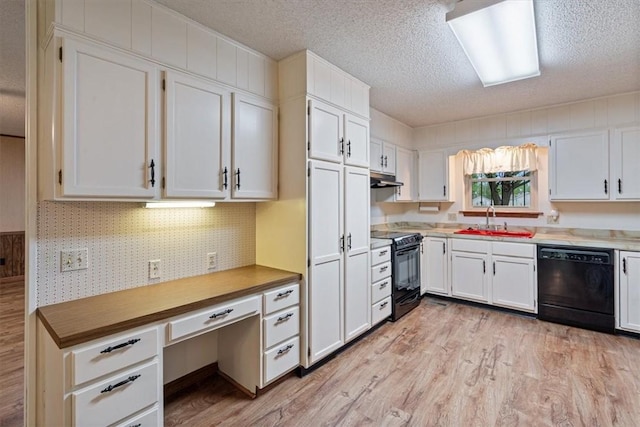 kitchen with black appliances, a sink, light wood-style floors, white cabinets, and a textured ceiling