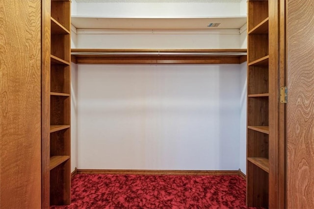 spacious closet featuring carpet floors