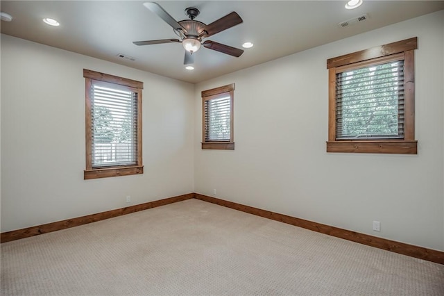 7 W Colonial Dr, Rogers, AR 72758 - empty room featuring light carpet, healthy amount of natural light, ceiling fan, baseboards, and recessed lighting