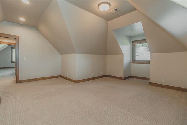 7 W Colonial Dr, Rogers, AR 72758 - bonus room featuring light carpet, lofted ceiling, baseboards, and recessed lighting