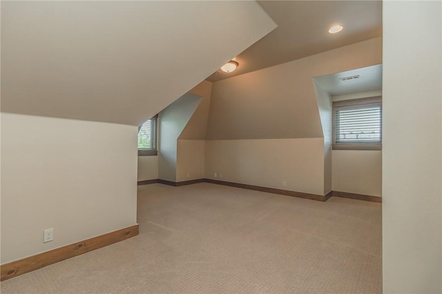 7 W Colonial Dr, Rogers, AR 72758 - additional living space featuring carpet flooring, plenty of natural light, baseboards, and lofted ceiling