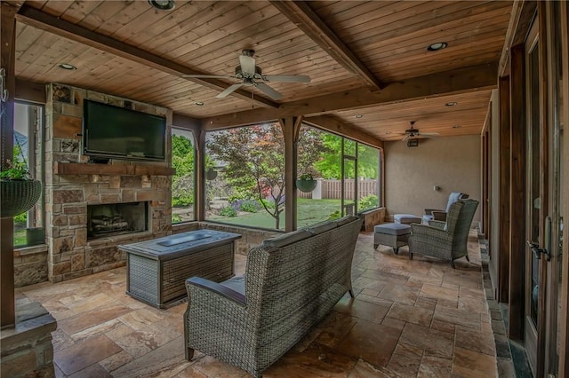 7 W Colonial Dr, Rogers, AR 72758 - sunroom with ceiling fan, beamed ceiling, and an outdoor living space with a fireplace