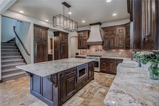 7 W Colonial Dr, Rogers, AR 72758 - kitchen featuring custom exhaust hood, appliances with stainless steel finishes, a sink, light stone counters, and tasteful backsplash