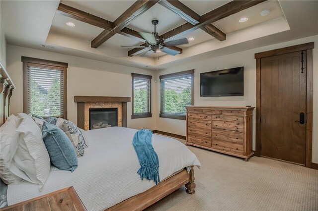 7 W Colonial Dr, Rogers, AR 72758 - bedroom featuring coffered ceiling, multiple windows, baseboards, beamed ceiling, and light carpet