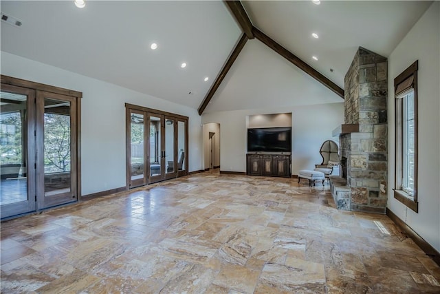 7 W Colonial Dr, Rogers, AR 72758 - unfurnished living room with french doors, beamed ceiling, high vaulted ceiling, baseboards, and stone finish floors