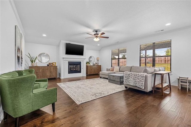 living room featuring a ceiling fan, dark wood finished floors, a fireplace, and recessed lighting