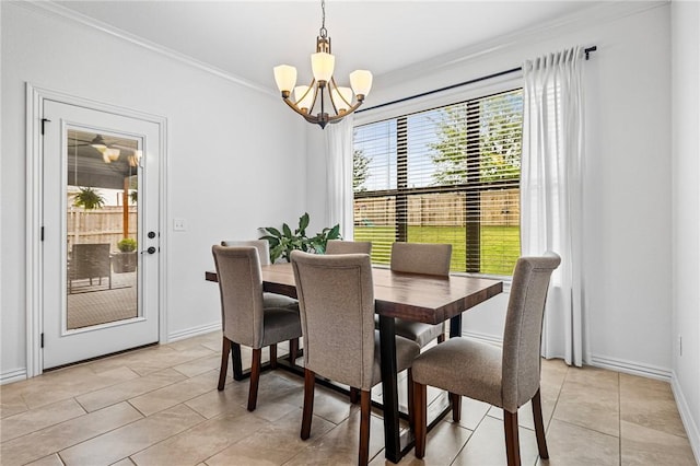dining room featuring a chandelier, crown molding, baseboards, and light tile patterned flooring