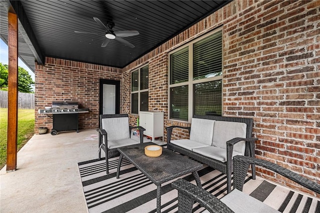 view of patio / terrace with an outdoor hangout area, a ceiling fan, and fence