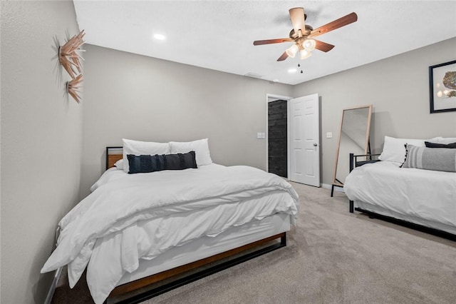 bedroom featuring light colored carpet, ceiling fan, and recessed lighting