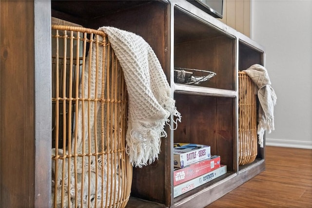 detailed view of baseboards and wood finished floors