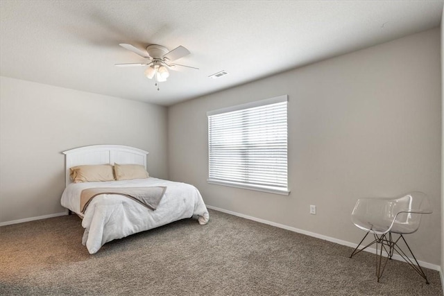 bedroom with carpet, ceiling fan, and baseboards