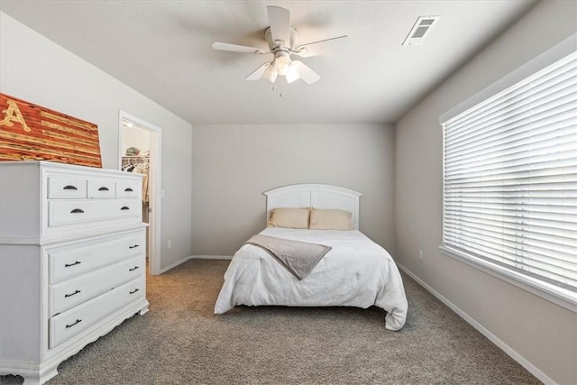 bedroom featuring light carpet, baseboards, and a ceiling fan