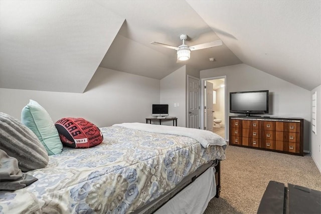 bedroom with carpet, lofted ceiling, ensuite bathroom, and ceiling fan