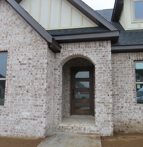 1214 Carrara St, Tontitown, AR 72762 - property entrance featuring brick siding
