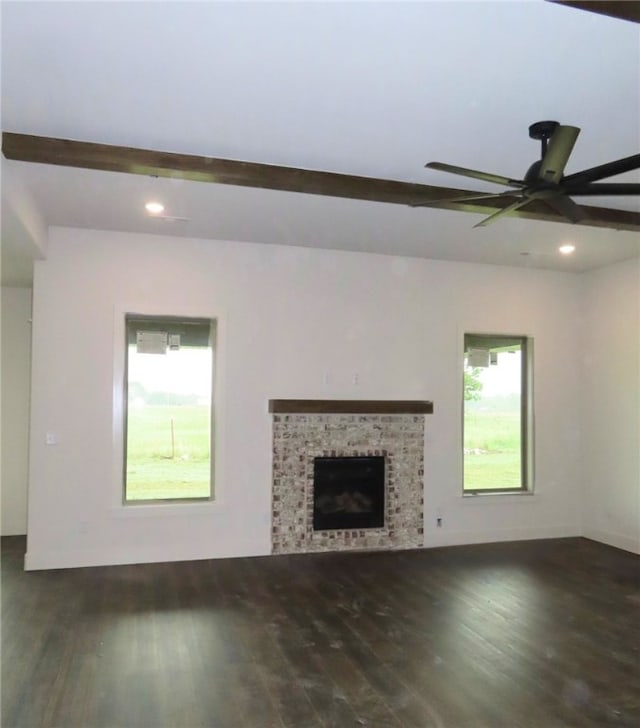 1214 Carrara St, Tontitown, AR 72762 - unfurnished living room with wood finished floors, a ceiling fan, recessed lighting, beam ceiling, and a brick fireplace