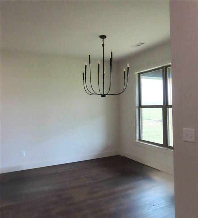 1214 Carrara St, Tontitown, AR 72762 - unfurnished dining area with a chandelier, dark wood finished floors, and baseboards
