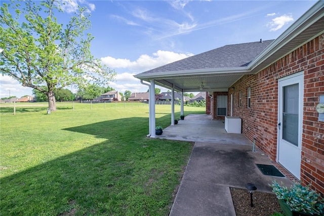307 E Edmondson Ave, Springdale, AR 72764 - view of grassy yard featuring a patio area and a ceiling fan