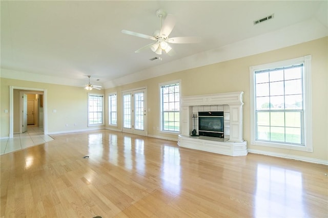 307 E Edmondson Ave, Springdale, AR 72764 - unfurnished living room with a ceiling fan, baseboards, and light wood-type flooring