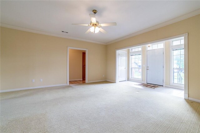 307 E Edmondson Ave, Springdale, AR 72764 - spare room featuring ornamental molding, baseboards, light colored carpet, plenty of natural light, and a ceiling fan