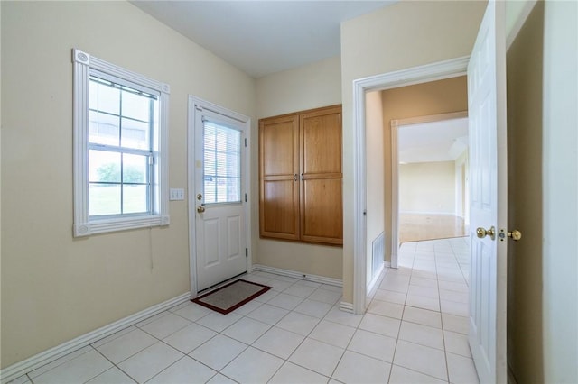 307 E Edmondson Ave, Springdale, AR 72764 - doorway to outside with light tile patterned floors and baseboards