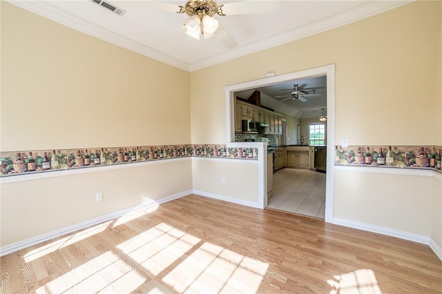 307 E Edmondson Ave, Springdale, AR 72764 - empty room with ceiling fan, ornamental molding, light wood-style flooring, and baseboards