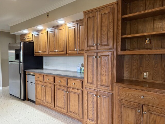 kitchen with brown cabinetry, freestanding refrigerator, ornamental molding, decorative backsplash, and open shelves