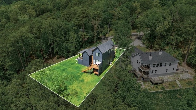 7 Thornbury Ln, Bella Vista, AR 72714 - aerial view of property and surrounding area featuring a heavily wooded area and property parcel outlined
