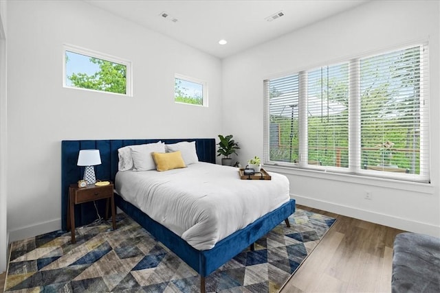 7 Thornbury Ln, Bella Vista, AR 72714 - bedroom featuring baseboards, wood finished floors, and recessed lighting
