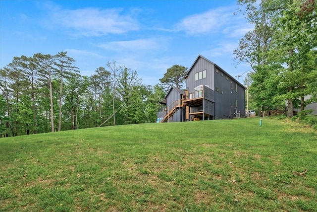 7 Thornbury Ln, Bella Vista, AR 72714 - view of grassy yard with a wooden deck and stairway