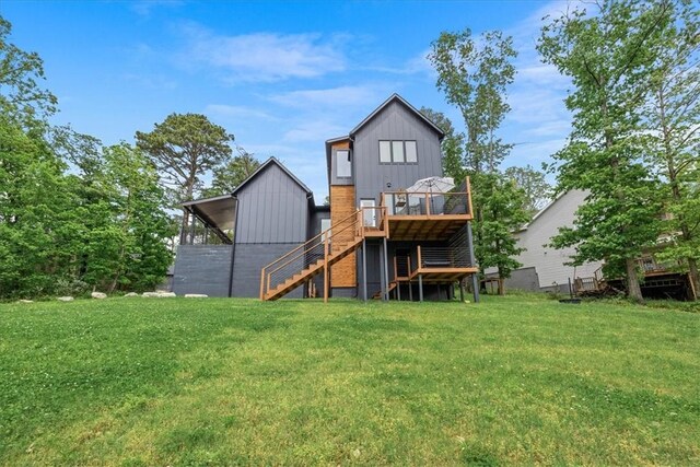 7 Thornbury Ln, Bella Vista, AR 72714 - back of property featuring stairway, a yard, a wooden deck, and board and batten siding