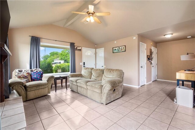 living room with light tile patterned floors, a ceiling fan, and baseboards
