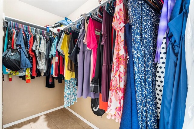 spacious closet featuring tile patterned floors