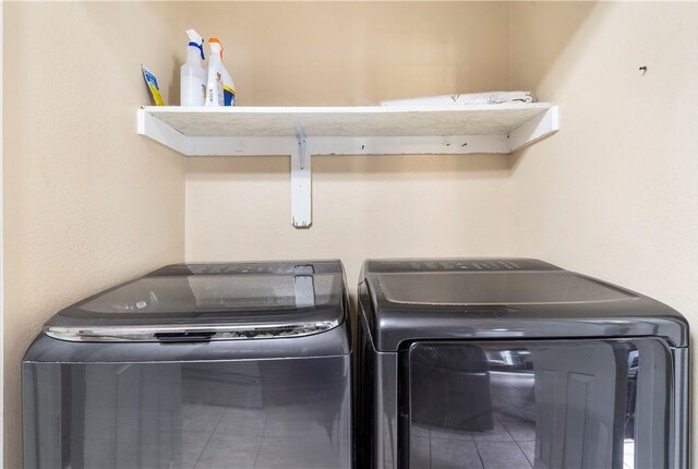 laundry room featuring washing machine and clothes dryer