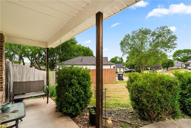view of patio featuring fence