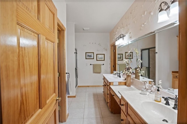 full bathroom featuring a shower stall, tile patterned floors, and vanity
