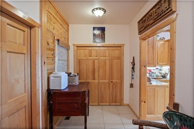 entrance foyer with light tile patterned floors