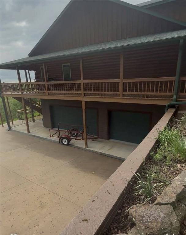 rear view of house featuring stairway