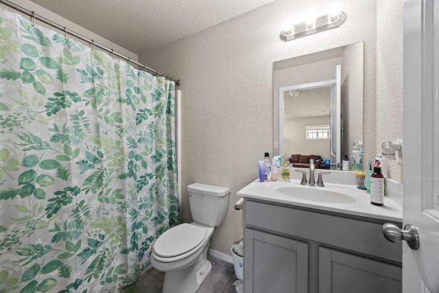 bathroom with toilet, a textured wall, vanity, a textured ceiling, and a shower with shower curtain