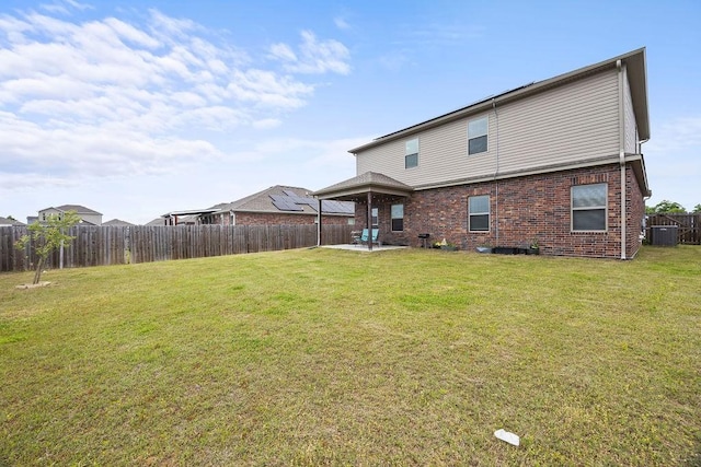 back of house featuring a patio and brick siding