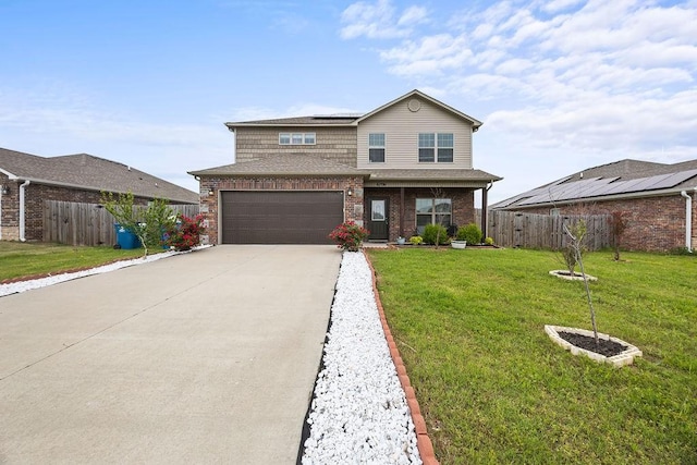 view of front of house featuring solar panels, driveway, brick siding, and a garage