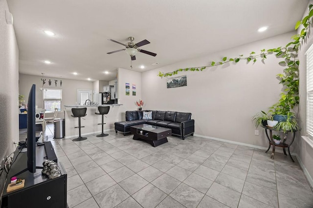 living room featuring ceiling fan, recessed lighting, baseboards, and light tile patterned floors