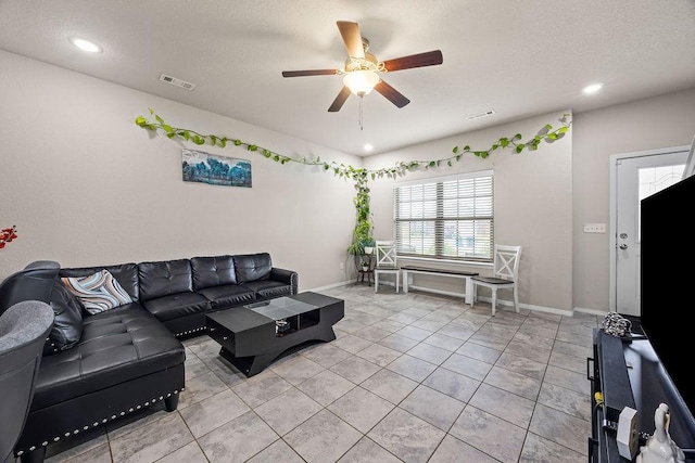 living area with a ceiling fan, baseboards, recessed lighting, and light tile patterned flooring