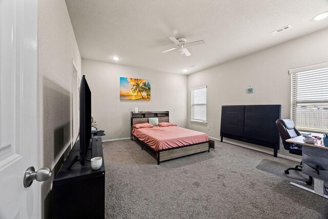bedroom with carpet, an office area, baseboards, ceiling fan, and recessed lighting