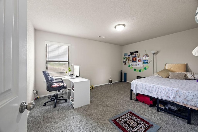 bedroom featuring carpet, a textured ceiling, an office area, and baseboards