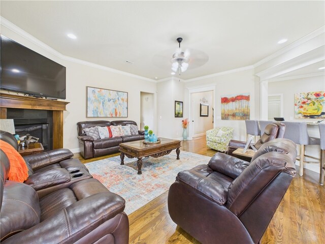 5708 S 60th Pl, Rogers, AR 72758 - living area featuring a glass covered fireplace, wood finished floors, crown molding, ceiling fan, and recessed lighting