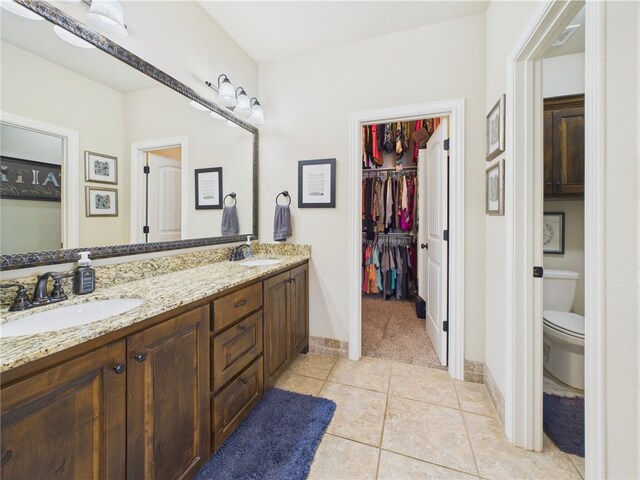 5708 S 60th Pl, Rogers, AR 72758 - full bath featuring double vanity, tile patterned flooring, and a spacious closet
