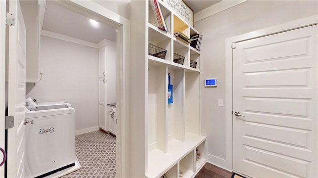 mudroom with washing machine and clothes dryer and baseboards