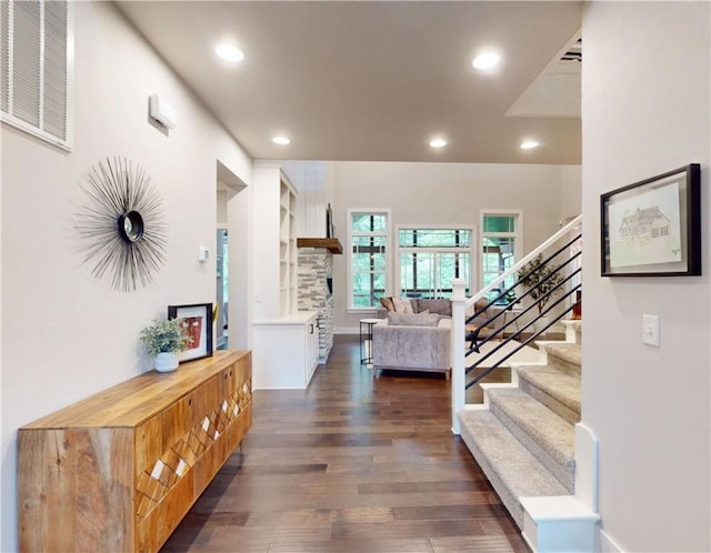 foyer entrance featuring stairway, dark wood finished floors, recessed lighting, and baseboards