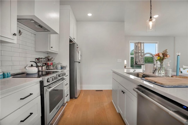 2630 N Gulley Grove Cir, Fayetteville, AR 72703 - kitchen featuring appliances with stainless steel finishes, custom range hood, a sink, backsplash, and light countertops
